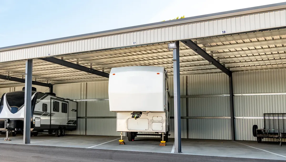 An RV parked in a covered storage space.